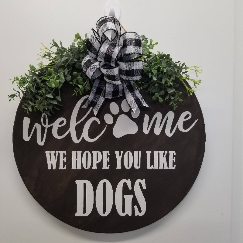 black and white sign with paw print