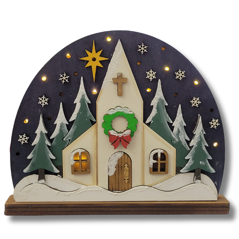Decorative Christmas scene with a church, trees, and a star on a dark blue background.