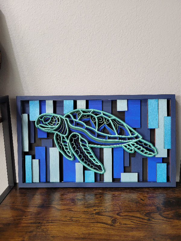 Decorative wall art with a turtle design on a striped background